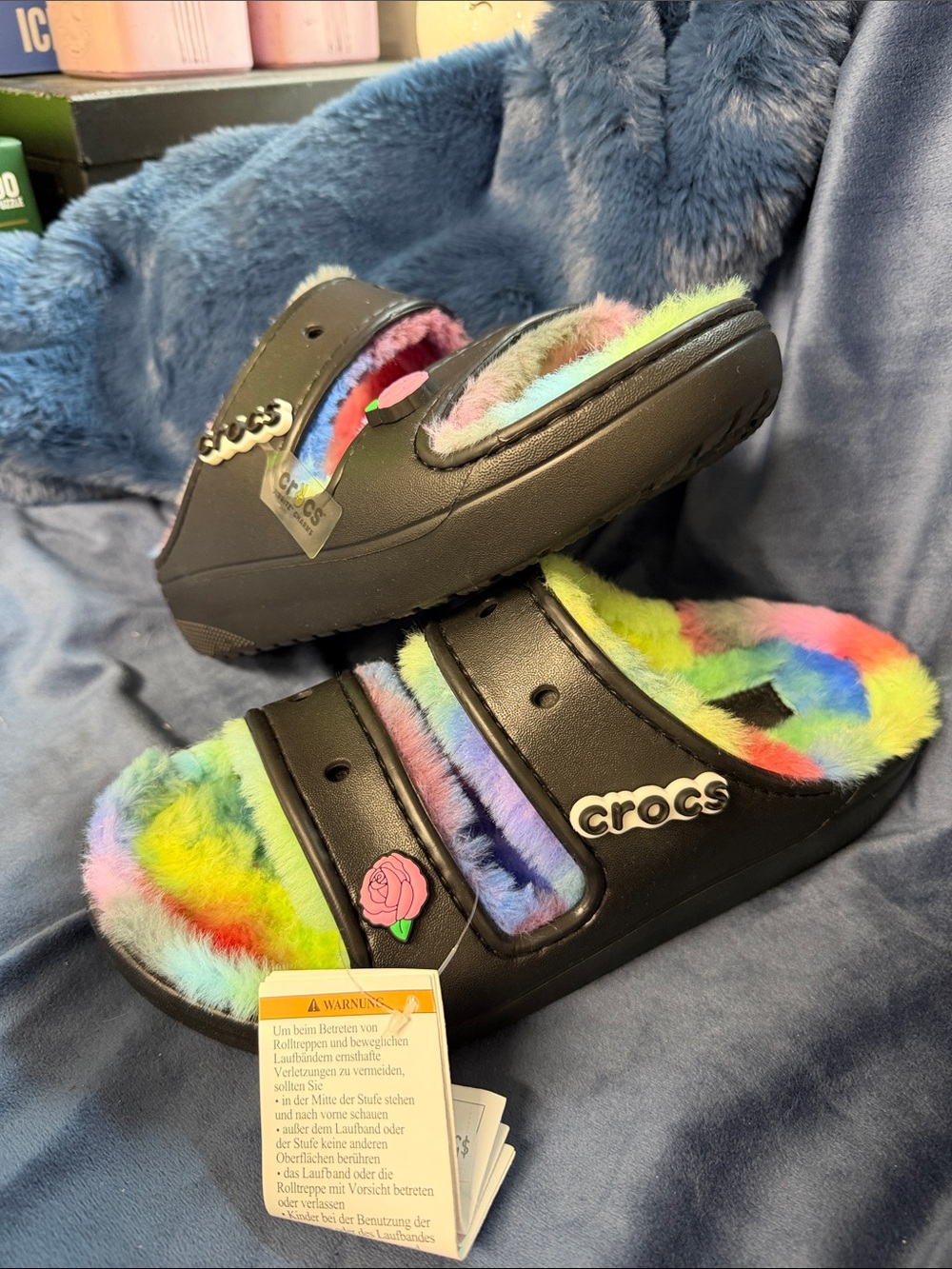 CROCS Black Slide Sandals with Rainbow Fuzzy Lining